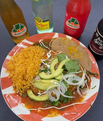 A close-up of a plate featuring a colorful assortment of vegetables, grains, and protein, arranged artfully.