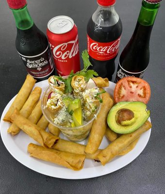 A plate of food featuring a colorful assortment of vegetables, grains, and protein, arranged appetizingly.